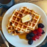 Golden waffles made from pancake mix served with syrup and berries