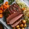 A top-down view of a beautifully plated corned beef and cabbage dinner.