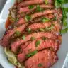 Top-down view of oven-baked corned beef and cabbage in a dish.