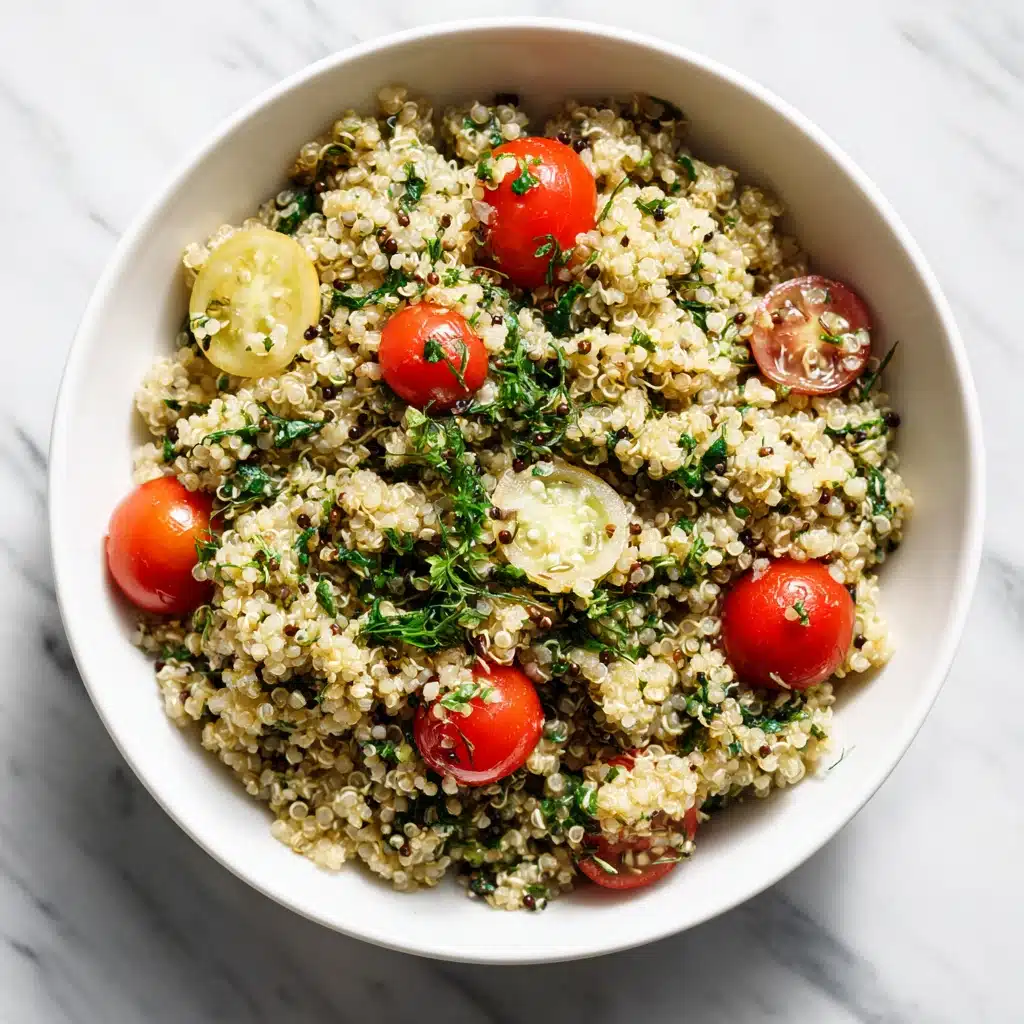 Quinoa side dish with fresh veggies in a bowl on marble