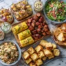 Top-down view of a crawfish boil table with 10 flavorful Southern-style side dishes.