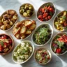 Italian side dishes spread on marble tabletop