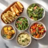 A variety of pasta side dishes arranged on a marble surface